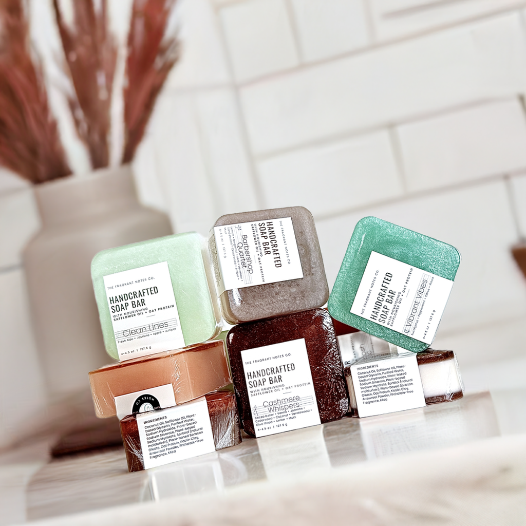 The Fragrant Notes Co. handcrafted soap bars with labels on a white surface