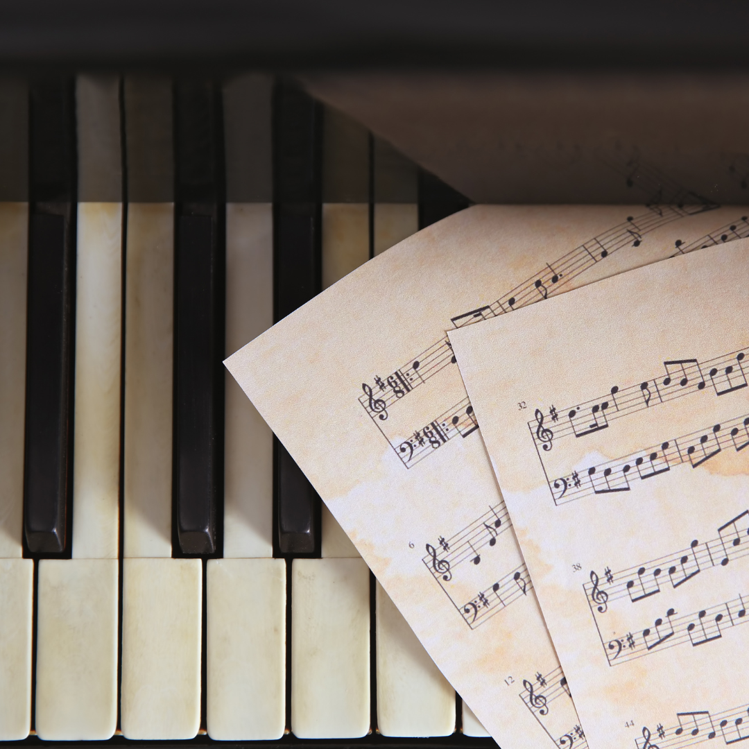 Sheet music on a piano keyboard